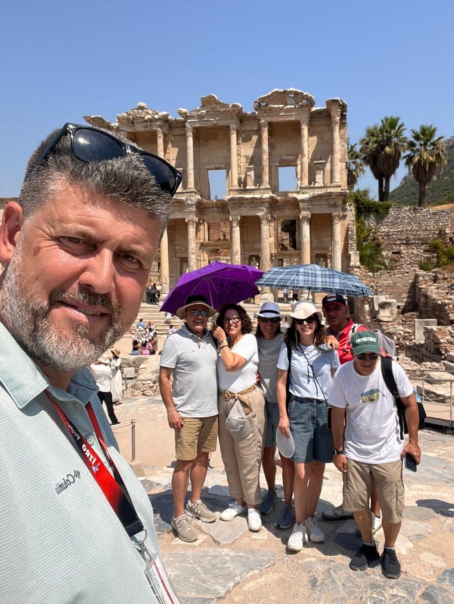 Tours of Ephesus guide Hakan Cebeci in a selfie with his Celebrity Xcel group before the Library of Celsus on a private Ephesus tour, 13 August 2026
